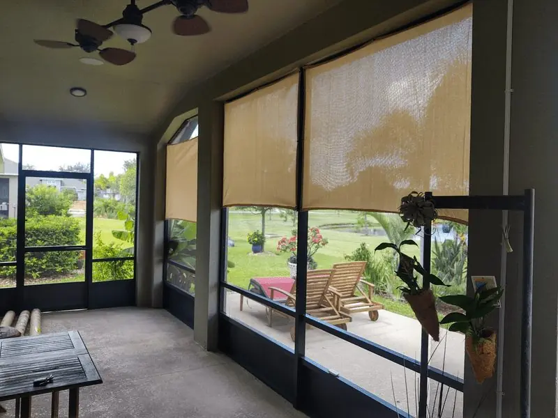 White shade sail over swimming pool